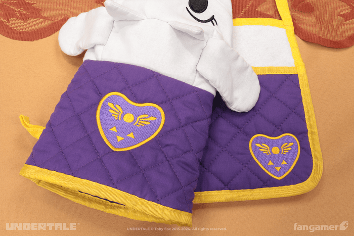 A closeup photograph of the matching embroidered Delta Runes on the Toriel oven mitt and potholder.