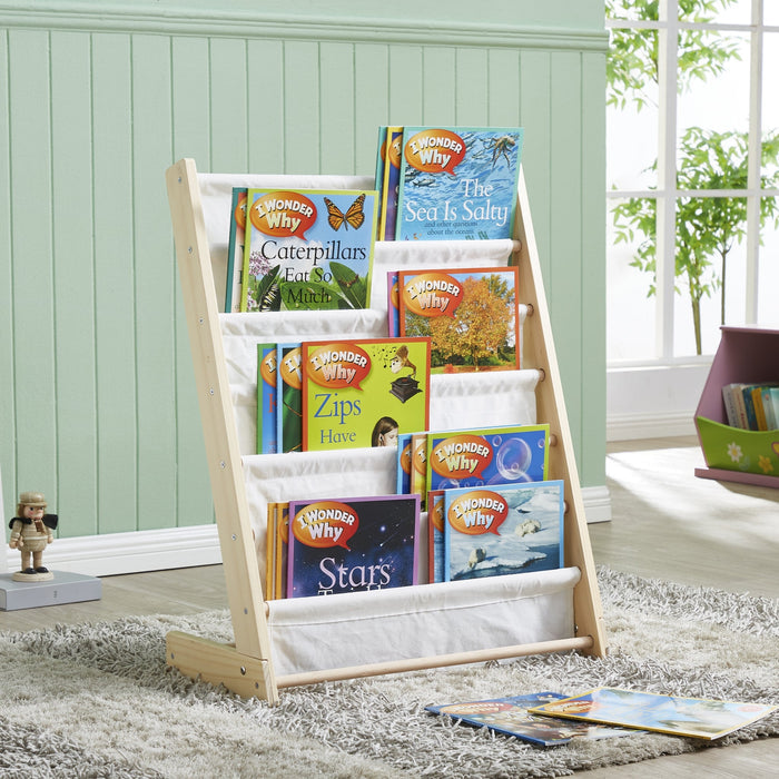 Henry natural wood kids canvas sling bookcase styled in a child's room and filled with picture books
