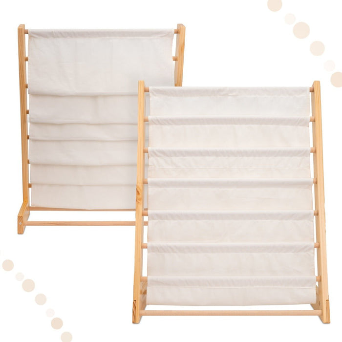 Front view of the natural wood kids canvas sling bookcase holding children's books in a playroom