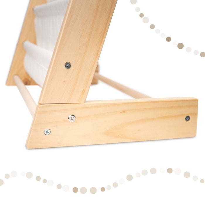 Close-up details of the cotton canvas slings and solid pine frame of the kids bookcase