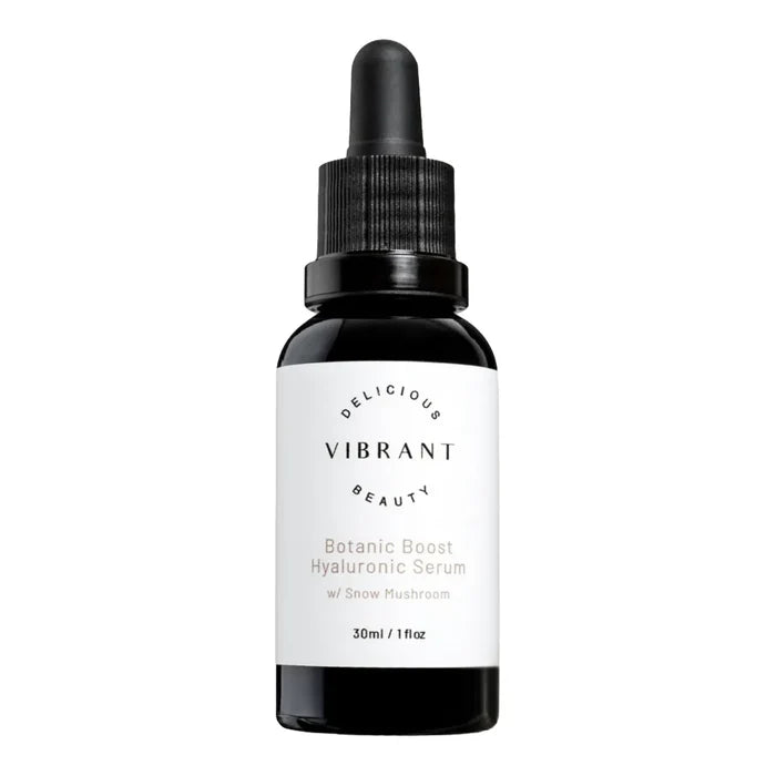 30ml black glass dropper bottle of Vibrant Beauty Botanic Boost Hyaluronic Serum with a white label.