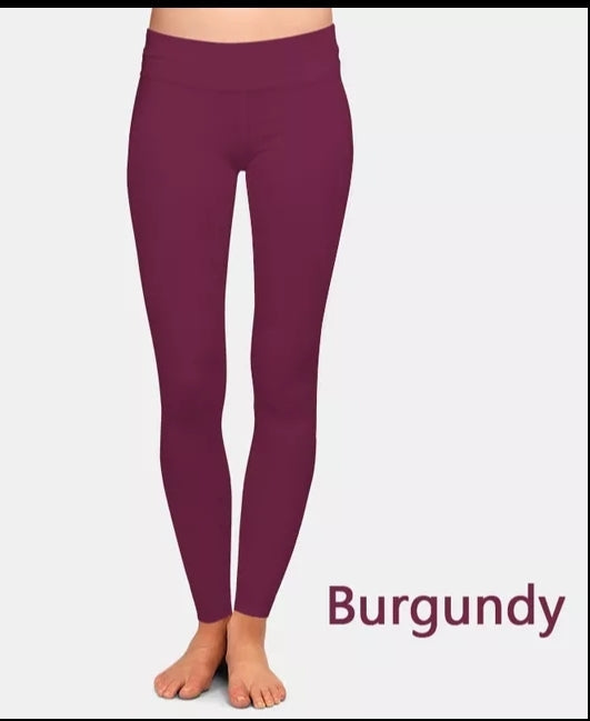 A pair of burgundy leggings