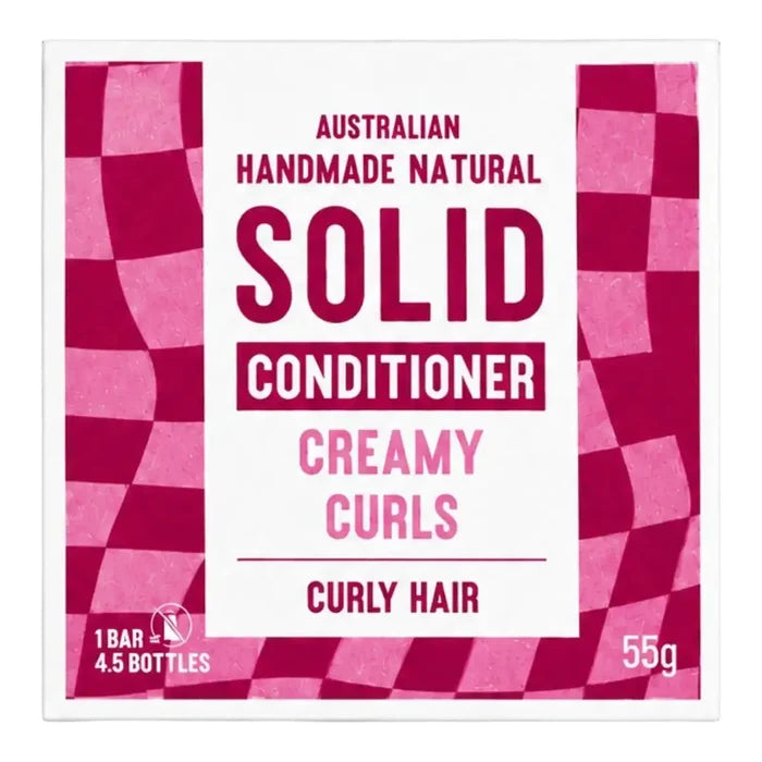 Front packaging of Australian Handmade Natural Solid Conditioner in Creamy Curls for curly hair, featuring a white center with magenta and pink checkered side panels.