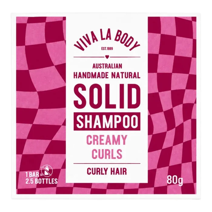 Viva La Body Solid Shampoo packaging for Creamy Curls, featuring a white central label framed by a magenta and pink wavy checkerboard pattern.