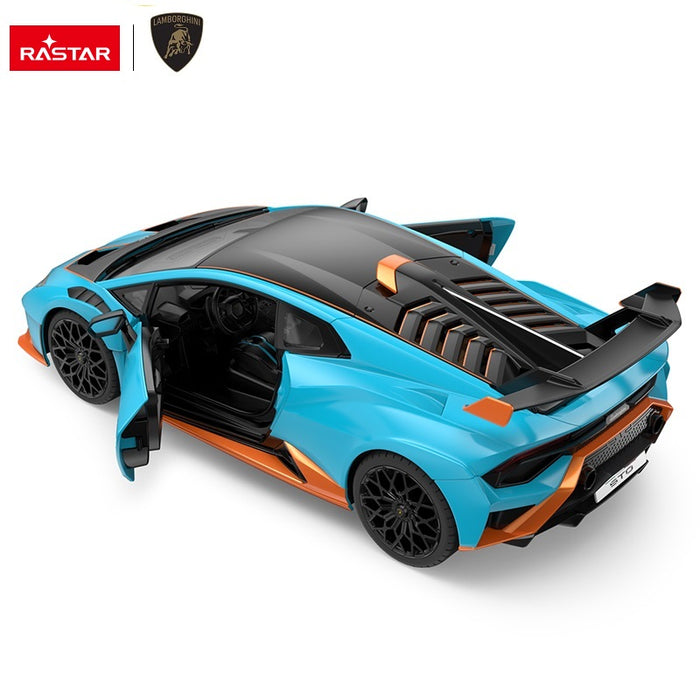 Rastar 1:14 Lamborghini Huracan STO RC car in sky blue with orange accents shown from a rear 3/4 elevated angle with door open. The carbon roof panel, rear wing, orange rear diffuser accents, and "Huracan STO" rear badging are clearly visible.