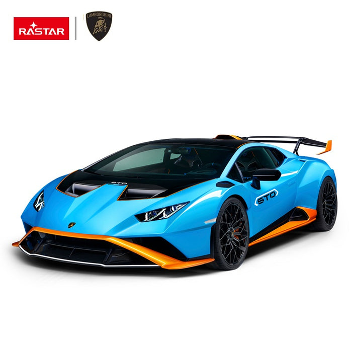 Rastar 1:14 Lamborghini Huracan STO RC car in sky blue with orange accents shown in front 3/4 profile without doors open. The shark-nose front splitter, angular headlights, STO hood scoop, wide wheel arches, and large rear wing are highlighted on a white background.