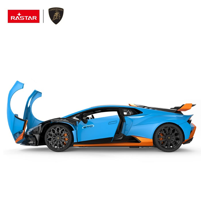 Rastar 1:14 Lamborghini Huracan STO RC car in sky blue with orange accents shown in strict left side profile with both doors open in scissor style. The full length of the car, STO door graphics, Lamborghini badged multi-spoke black wheels, and rear wing profile are all visible.