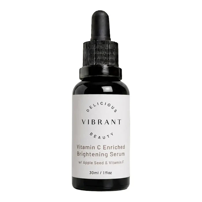 A 30ml black glass dropper bottle of Vibrant Beauty Vitamin C Enriched Brightening Serum, featuring a white label with black text, set against a plain white background.